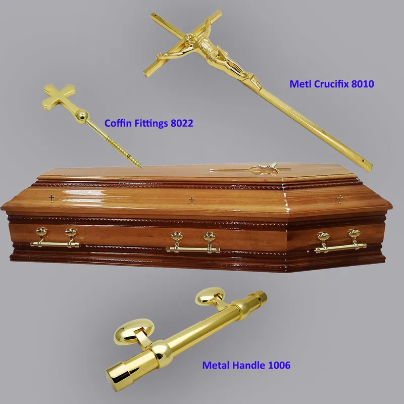 Layout showing a metal crucifix, coffin fittings and a metal handle positioned on a coffin