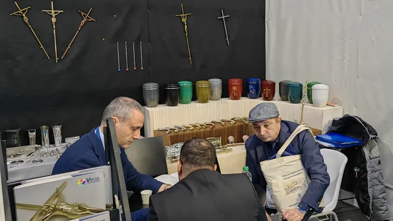 Virtue Hardware Co., Ltd exhibition stand at a funeral trade fair in France showing coffin handles and crucifix samples on display