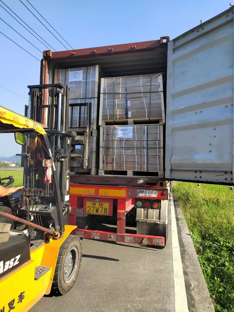 Cartons of funeral hardware being loaded into a shipping container by forklift at the Virtue Hardware Co., Ltd factory